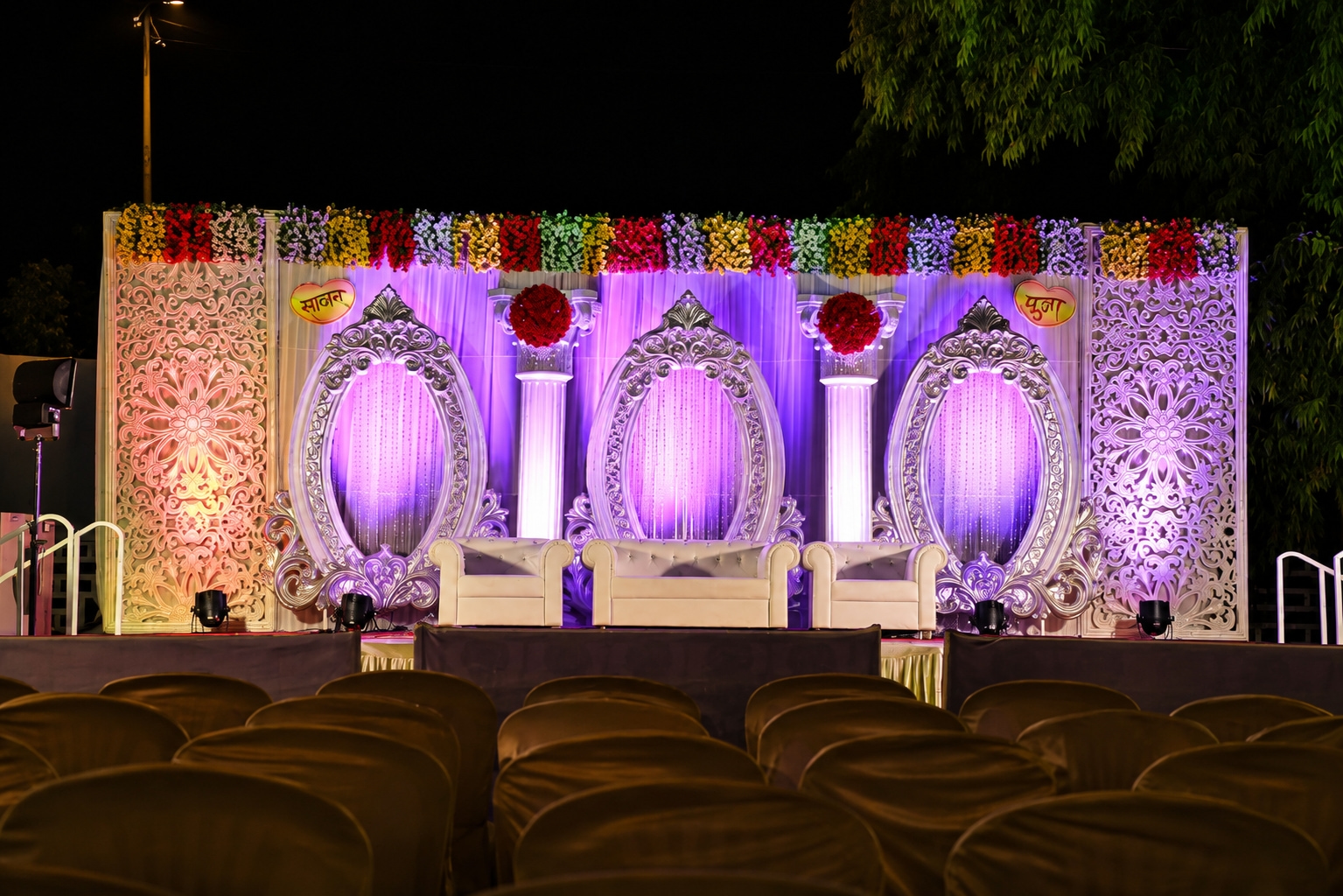Elegant Wedding Stage with Vibrant Lighting