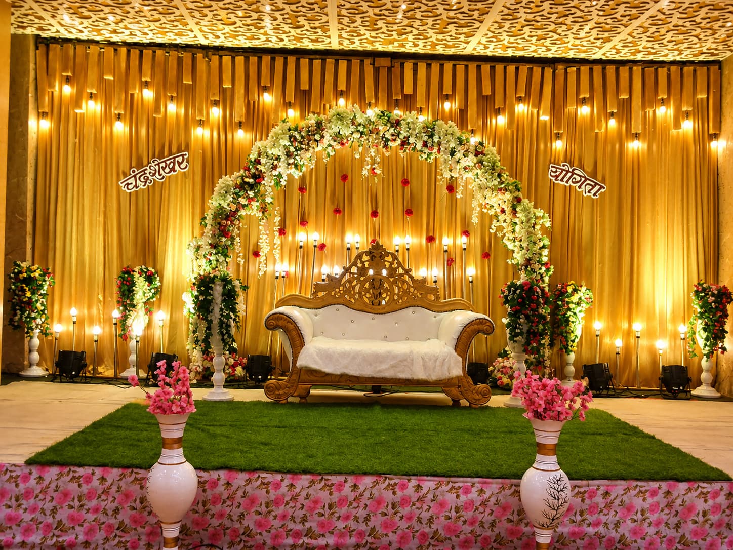 Ornate Golden Wedding Stage with Floral Arch